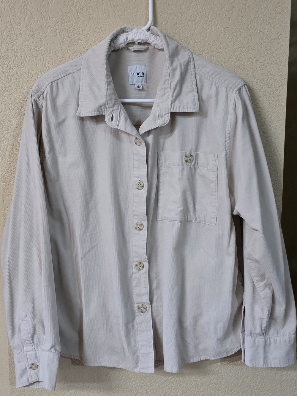 Kensie Jeans Cream Label on Light Beige Fabric